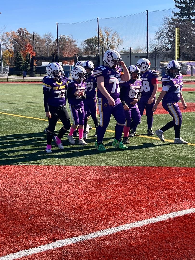 Brayden Wilson football team walking the field